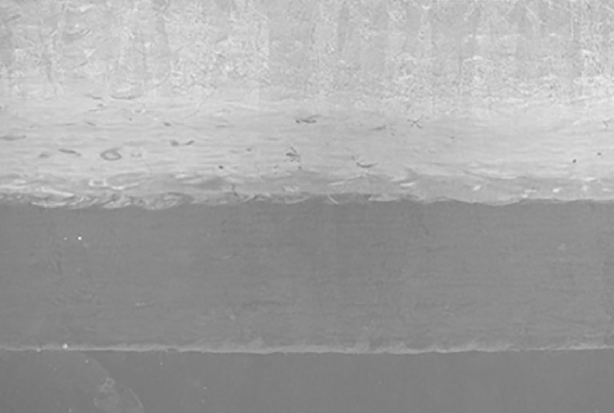 Electron micrograph of a MAPS build cross-section: high-entropy alloy on Inconel 718 on stainless steel 304, fused to the build plate